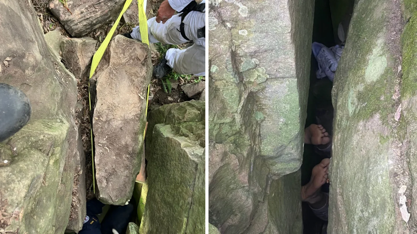 Woman left hanging upside down between two rocks